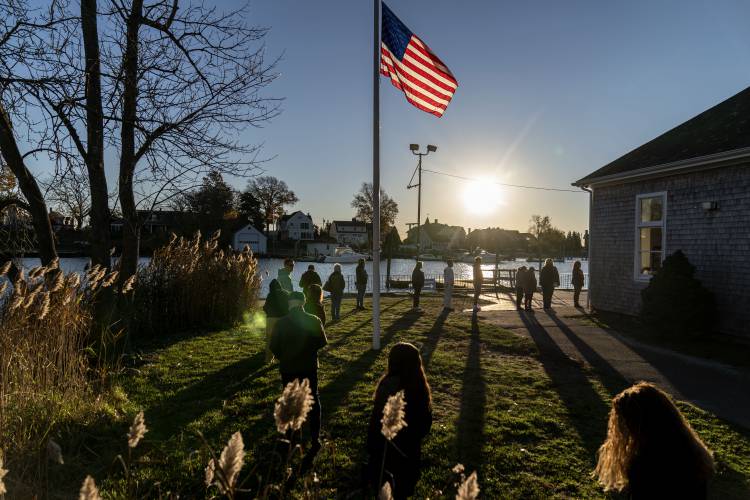 Voters line up to cast their ballots in the midterm election at the Aspray Boat House in Warwick, R.I., Tuesday, Nov. 8, 2022. Voters line up to cast their ballots in the midterm election at the Aspray Boat House in Warwick, R.I., Tuesday, Nov. 8, 2022.