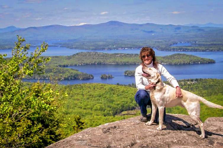 Bobbie Miller and her dog on top of Mount Major.
