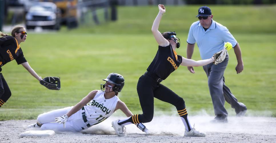 Bishop Brady baserunner Payton Bryson slides safely into second base as Conant shortstop Sophia Spingola bobbles the ball during a May 29 game.