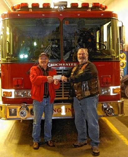 Chichester Fire Chief Alan Quimby (left) received a donation from Iron Mike Dempsey, president of the White Mountain Chapter of the Nam Knights of America Motorcycle Club in 2017. Chichester Fire Chief Alan Quimby (left) received a donation from Iron Mike Dempsey, president of the White Mountain Chapter of the Nam Knights of America Motorcycle Club in 2017.