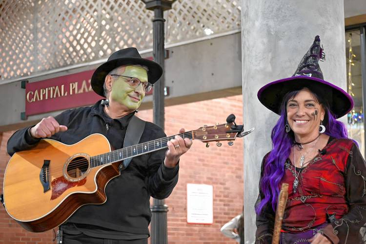 Dave and Susan Bastien performed some spooky Halloween songs during the Halloween Howl in downtown Concord Friday night. 