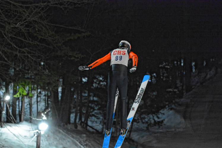Concord’s Sebastian Christie flies through the air at the NHIAA Ski Jumping State Championship at the Roger Burt Memorial Jump at Oak Hill in Hanover on Friday. Christie, Concord's only jumper, finished eighth.