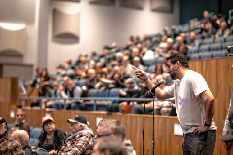 Bow resident Brian Murphy urges residents to turn down an amendment to lower the contributions to the capital reserve fund at town meeting on Wednesday. The amendment was defeated and residents voted to approve the capital reserve fund request.