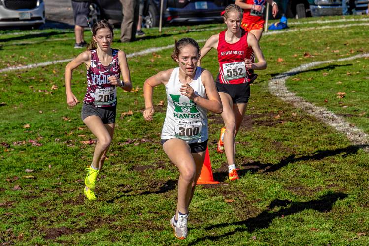 Hopkinton’s Maddy Lane leads the way 1,000 meters into the 5K race at the NHIAA Division III girls’ state championship at Derryfield Park in Manchester on Saturday. Lane went on to win the individual title in 19 minutes, 31 seconds, leading Hopkinton to second place as a team.