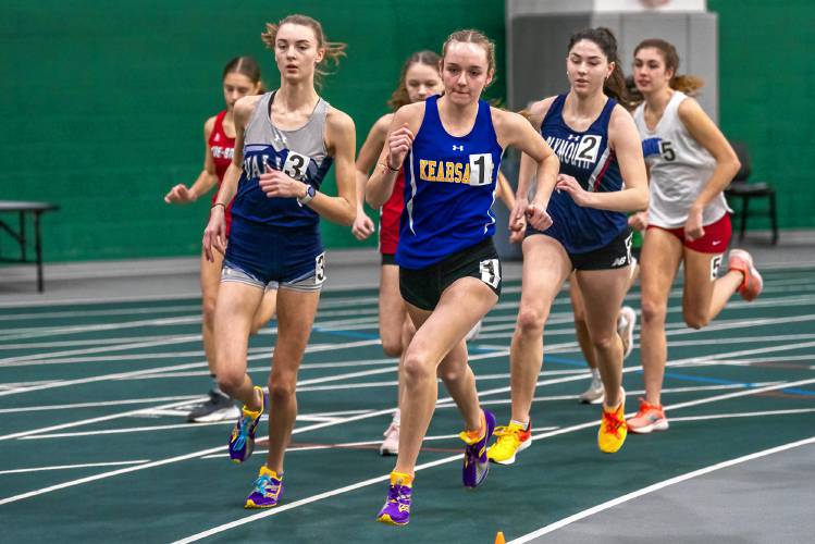 Kearsarge’s Molly Ellison (1) and Merrimack Valley’s Madison Geddes (3) race in the 1,000 meters on Saturday at Plymouth State. Ellison went on to win in 3 minutes, 11 seconds, to help lead Kearsarge to the victory in the 17-team meet.