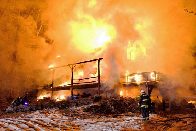 A two-alarm fire in Warner destroyed a log cabin on Marsh Lane just before 8 p.m.. 