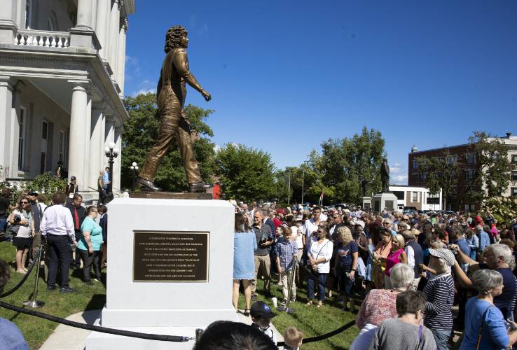 The crowd looks at the dedication of the Christa McAuliffe statue in her honor on Monday.
