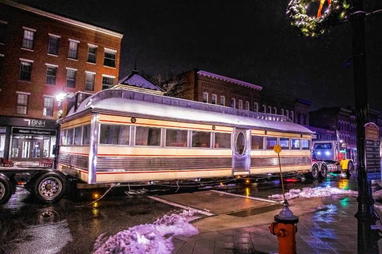 A Geddes Building Mover truck with a low load trailer makes its way on North Main Street with the main portion of the diner on early Wednesday morning.