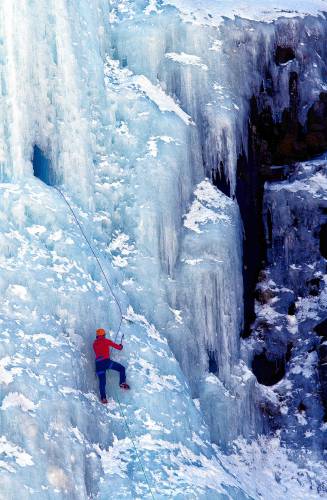 An ice climber makes their way up Frankenstein Cliff  March 19, 2015, in Harts Location, N.H. The climber this weekend was injured in Shoestring Gully.