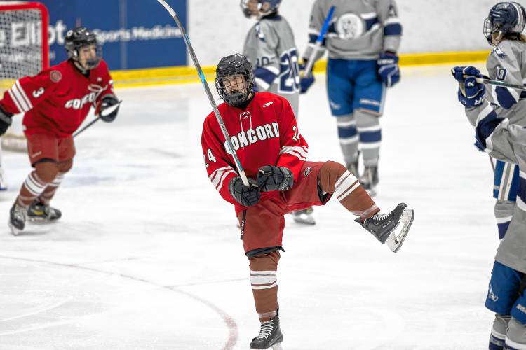 Concord’s Tyler Mayo (24) celebrates after scoring the Tide’s third to secure the win and the Brian C. Stone Memorial Christmas Tournament title on Saturday at JFK Coliseum in Manchester. Concord defeated Exeter, 3-1, in the final.
