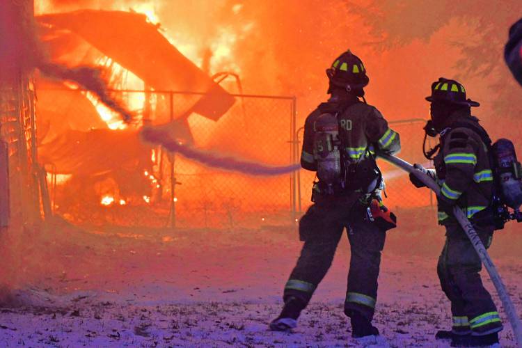 Firefighters work to put out a blaze in Franklin.