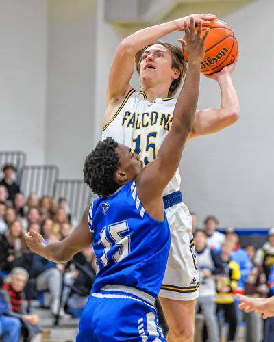 Bow’s Harrison Denise goes up for a shot late in the game against Pelham on Friday at Bow High School. The Falcons defeated two-time defending champion Pelham, 48-24.