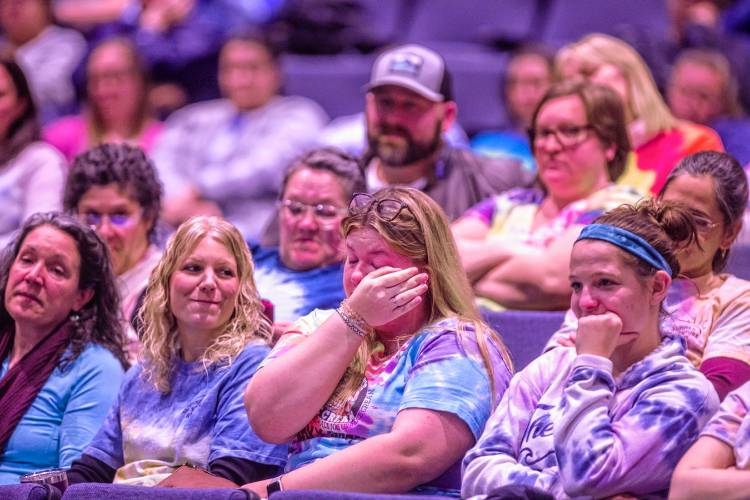 Webster Elementary kindergarten teacher Nicole Graczewski reacts after speaking to the Merrimack Valley School Board about the proposed budget cuts that would eliminate her position at the school year.