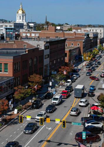 Main street Concord taken from the balcony of the Hotel Concord. In 2015 construction started on a redesign that along with many other things  brought   four lanes of traffic down to two and widened sidewalks. 