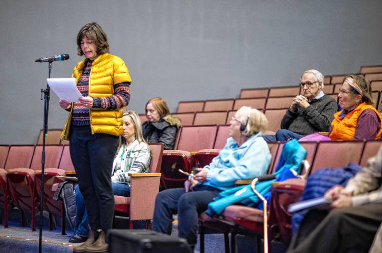 Kassandra Ardinger speaks in favor of building the new middle school on the present Rundlett site on Wednesday. The school board voted to build the school on the alternative site at the Broken Ground School site.