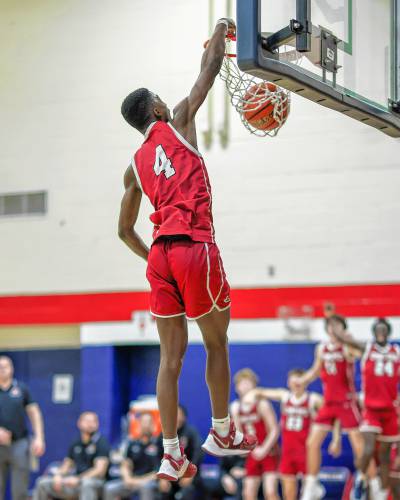 Concord’s Alain Twite (4) throws down a dunk during the Capital Classic boys’ championship game against Merrimack Valley on Friday at John Stark Regional High School in Weare. Twite scored a game-high 21 points to be named the Tournament MVP as Concord defeated MV, 58-46.