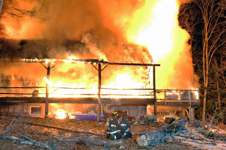 A two-alarm fire in Warner destroyed a log cabin on Marsh Lane just before 8 p.m.. 