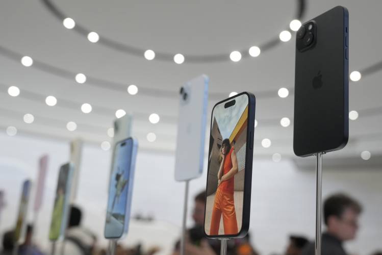FILE - iPhone 15 phones are shown during an announcement of new products on the Apple campus in Cupertino, Calif., Sept. 12, 2023. The Justice Department announced a sweeping antitrust lawsuit Thursday, March 21, 2024 against Apple, accusing the tech giant of having an illegal monopoly over smartphones in the U.S. (AP Photo/Jeff Chiu, File)