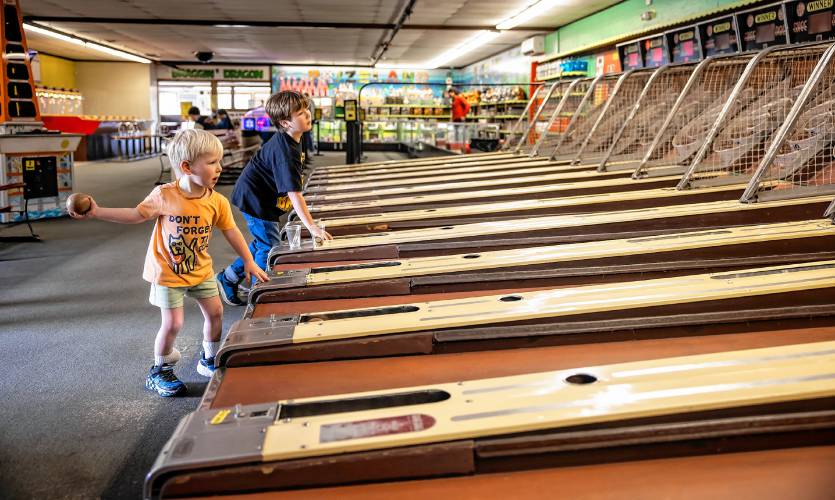 Jackson Lawrence, 3, plays the old-fashioned Skee Ball with his family at Fun Spot in Laconia on Monday, May 6, 2024. The family came on a Monday so the crowds were not there but owner DaveLawton says that on a rainy day in the summer, the arcade is full of families that have come to the Lakes Region.