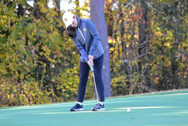 Bishop Brady’s Mady Savary putts at the Division III golf championship on Thursday at Rochester Country Club. Savary carded a 75 on the par 72 course to earn medalist honors, lifting Brady to its first team title since 2005.