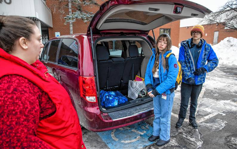 Amber MacQuarrie gets ready to drop off her children, Olive and Ethan, at the KaiPod Learning Center in Manchester on Friday, February 21, 2025.