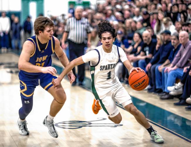 Pembroke guard Evan Berkeley (right) is the Monitor’s boys’ basketball Player of the Season for his all-around abilityin leading the Spartans to the Division II state championship.