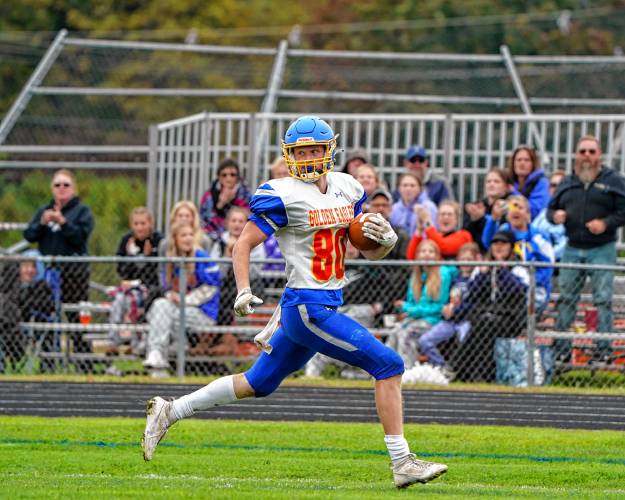 Gilford-Belmont’s Logan Grant heads for the end zone for one of his three touchdown catches at Pembroke Academy on Sept. 23. Grant, a wide receiver, was named to the Division II East First Team.