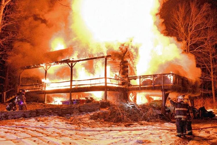 A two-alarm fire in Warner destroyed a log cabin on Marsh Lane just before 8 p.m. on Thursday, Feb. 15. 