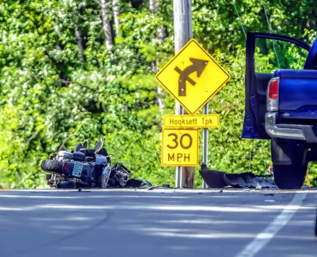 A motorcycle rests in the middle of Clinton Street near the Hooksett Turnpike intersection in Concord on Tuesday morning, July 16, 2024. The driver of the motorcycle was killed when it struck a blue pickup at right.