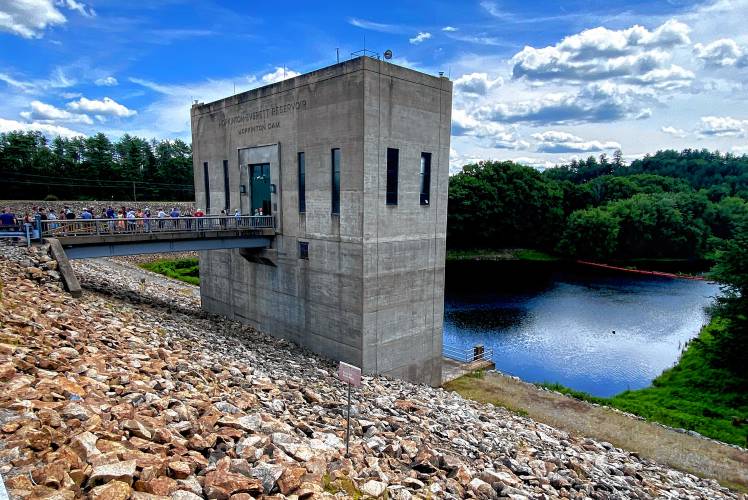 People attend a tour of the gatehouse of the Hopkinton Dam on Route 127 in Contoocook. The Hopkinton-Everett Lakes project provides flood protection on the Contoocook and Piscataquog rivers, which are tributaries of the Merrimack River.