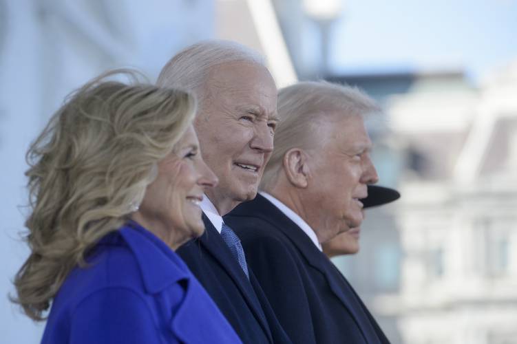 President Joe Biden looks on as he and first lady Jill Biden welcome President-elect Donald Trump and Melania Trump on the North Portico of the White House in Washington, Monday, Jan. 20, 2025. (AP Photo/Rod Lamkey, Jr.)