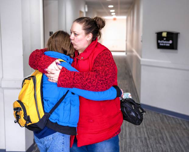 Amber MacQuarrie hugs her daughter Olive before dropping her off at the  KaiPod Learning Center in Manchester on Friday, February 21, 2025.