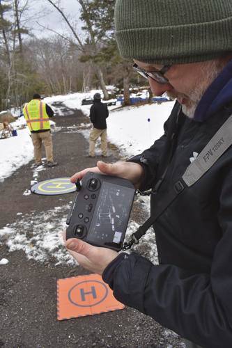 Rob Russell shows how the drone he operates has the ability to search for infrared light, which indicates a heat source. The drones are part of a search effort on Thursday to locate Ashley Turcotte, who went missing in Barnstead last week. 