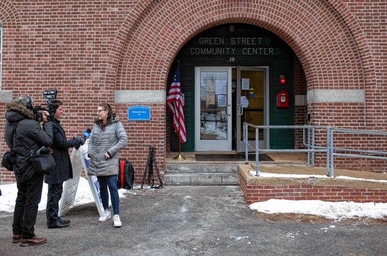 Cassy Morand of Concord gets interviewed by a Voice of America crew in front of the Ward 4 Primary voting polling on Tuesday, January 23, 2024.