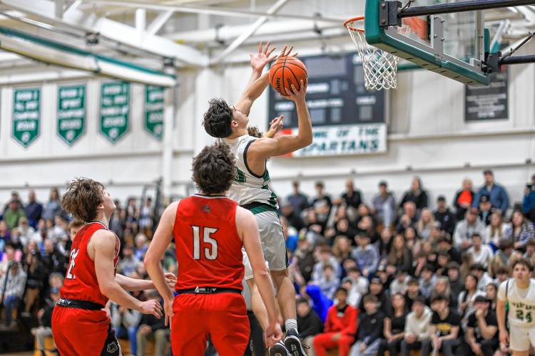 Joe Fitzgerald floats up a contested shot for the Spartans during their 65-47 win over Coe-Brown on Monday.