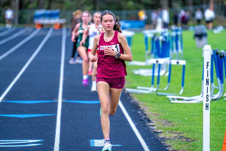 Concord’s Shelly Smith crosses the finish line to claim the victory in the 3,200 meters at the Merrimack Invitational on Thursday.