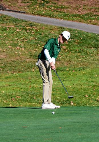 Bishop Brady’s Chase Connor putts at the Division III golf championship on Thursday at Rochester Country Club. Connor tied for third to make the cut for the individual championship final round, helping Brady to its first team title since 2005.