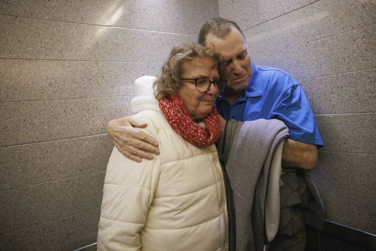Tim Andrews and his wife, Karen, share an embrace while leaving Massachusetts General Hospital in Boston on Feb. 1, 2025. (Kate Flock/Massachusetts General Hospital via AP)