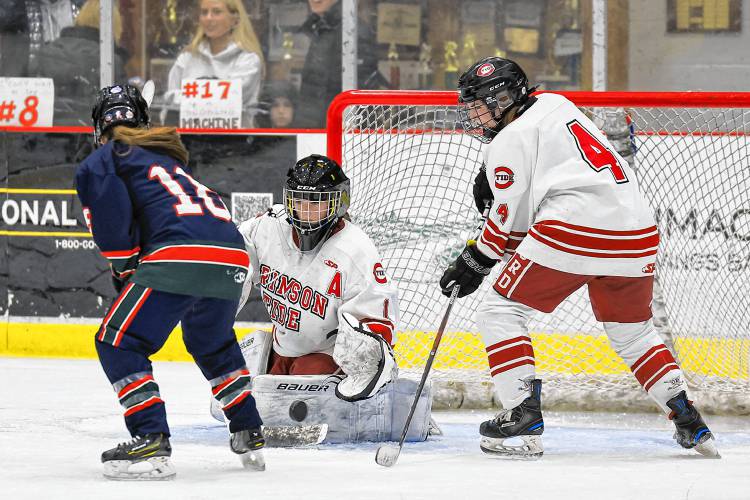 Concord goaltender Kaylee DelloIacono makes a save against St. Thomas-Winnacunnet-Dover on Saturday. Concord came back from a 2-0 deficit to win 3-2, the Tide's ninth consecutive victory.
