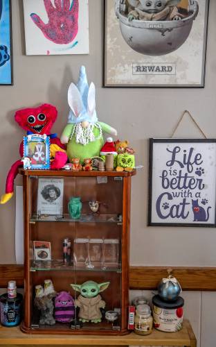 Brie Lamarche special case in her kitchen containing memories, including the memorial card for her grandfather.