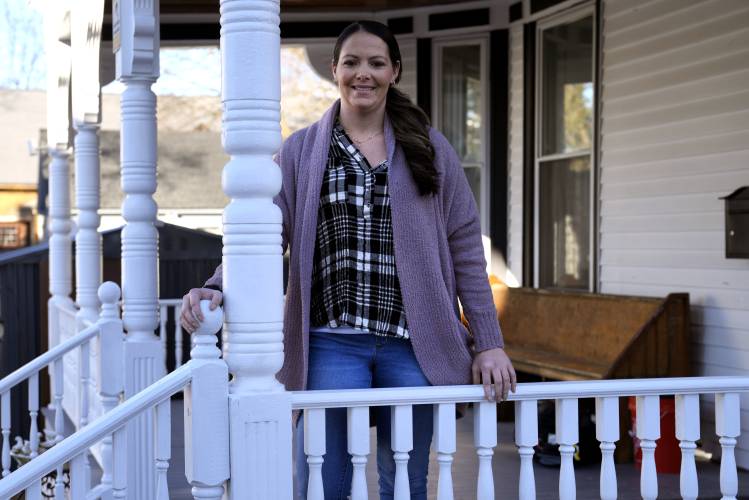 Kristina Amyot poses on the porch of a sober-living home, where she resided for about two years, at the Hope on Haven Hill, a residential, outpatient and recovery support service provider for pregnant, post-partum and parenting women, Friday, Jan. 12, 2024, in Rochester, N.H. Amyot, 36, spent more than half her life struggling with addiction, mainly to heroin. Drug overdose deaths in New Hampshire have increased in recent years, and some residents want to hear more from the...