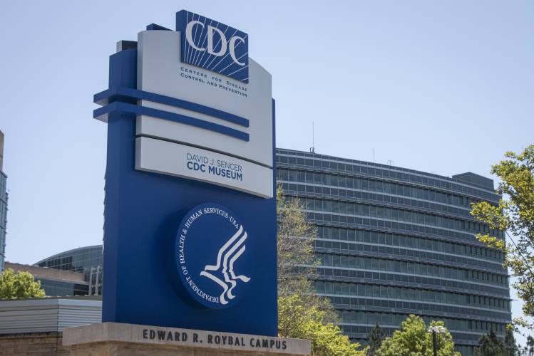 A Centers for Disease Control and Prevention sign stands at the entrance of their offices in Atlanta on April 19, 2022.