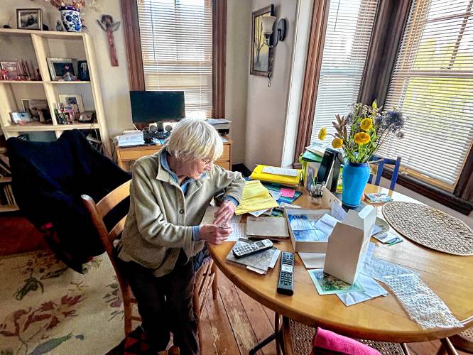 Barbara Filion writes letters for her loved ones at her dining table on a Thursday afternoon.