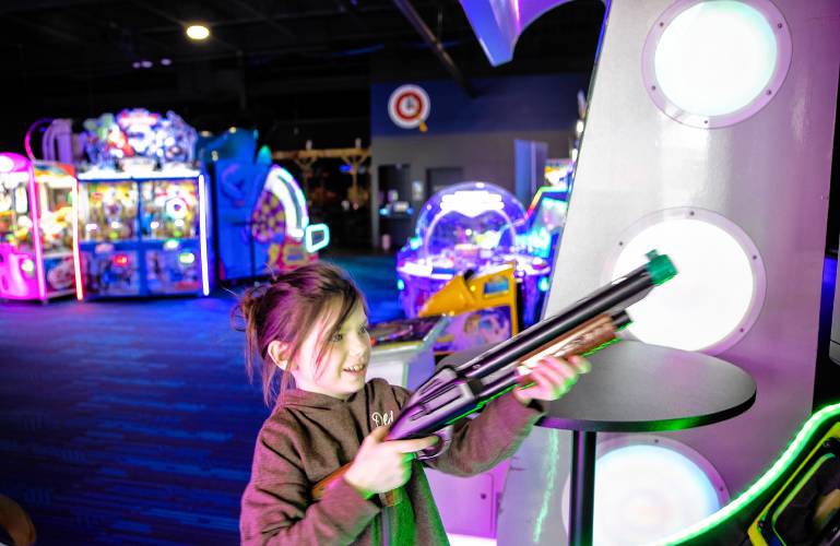 Audrey Lunn, 7, plays at the Smitty’s Cinema arcade area in Tilton on the eve of her birthday with her parents on Wednesday, April 25, 2024. The arcade couples with the movie theatre on the other side gives people a greater entertainment option.