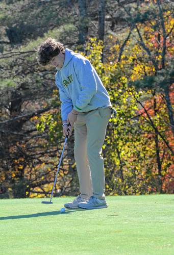 Bishop Brady’s Luke Bedard putts at the Division III golf championship on Thursday at Rochester Country Club. Bedard made the cut for the final round, helping Brady to its first team title since 2005.