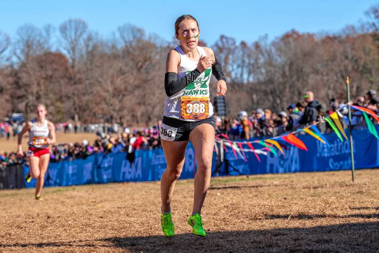 Hopkinton's Maddy Lane races at the New England Interscholastic Cross Country Championship on Saturday at Wickham Park in Manchester, Conn. Lane ran the 5K in 18:22 to finish fifth in New England, the second-fastest N.H. runner across the line.