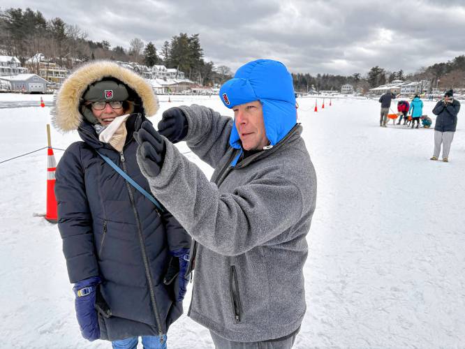 Retired pilot William McGowan of Gilford, a pilot with American Airlines for 32 years, along with Allison Toates as they watched traffic at Alton Bay Ice Runway on Sunday.