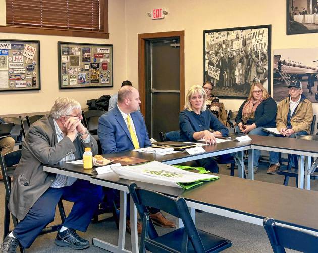 Members of Kelly Ayotte’s newly formed Commission on Government Efficiency, House Speaker Sherman Packard (left) and New Hampshire DMV director John Morasco (center), look on as Jennifer Parent shares an update about her meetings with state department heads at the COGE’s first public meeting on Wednesday.