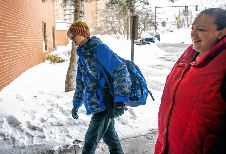 Amber MacQuarrie gets ready to drop off her son, Ethan, at the KaiPod Learning Center in Manchester on Friday, February 21, 2025.