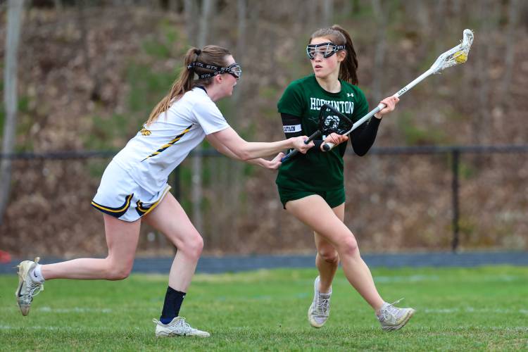 Junior captain Maeve Owens (9) scored five goals for the Hawks to help them come back against Bow in a 14-8 victory.